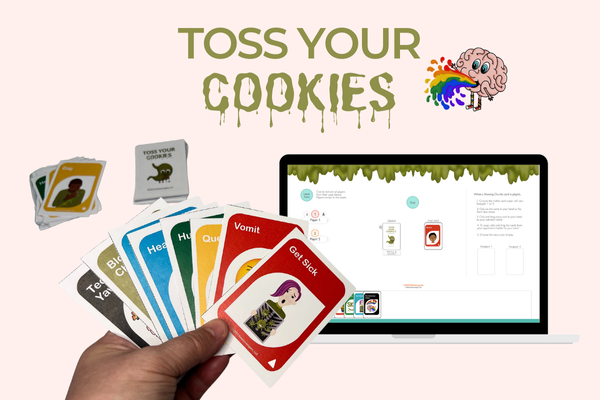 A hand holding several colorful cards, each with different text and images, in front of a laptop displaying a card game interface. The background features the text "TOSS YOUR COOKIES" with a colorful, vomiting brain illustration. A stack of cards lies to the left.